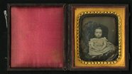 Thumbnail preview van Full length frontal portrait of seated child …
