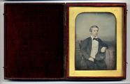 Thumbnail preview of Three quarter portrait of a  boy seated with …
