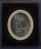 Miniaturansicht Vorschau von A half length portrait of a seated woman wear…