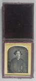 Thumbnail af Half length portrait of a young woman  seated…