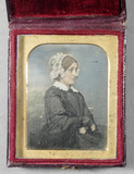 Thumbnail af Half length portrait of a seated woman with d…