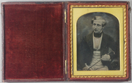Forhåndsvisning av Seated portrait of a middle aged man holding …