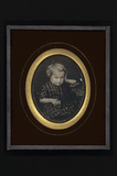 Prévisualisation de Portrait of a child, girl; posing with one ha… imagettes