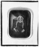 Thumbnail af portrait of a seated woman with bonnet, a boo…