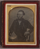 Thumbnail af three-quarter length portrait of a seated man