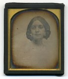 Thumbnail preview of Vignette portrait of young woman with thick b…