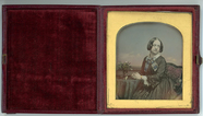 Thumbnail preview of Three quarter portrait of a seated woman.wear…
