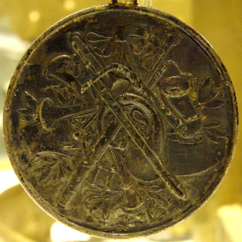 Medaille van metaal behorend bij het vaandel van de R.K. muziekvereniging St. Joseph Didam circa 1929